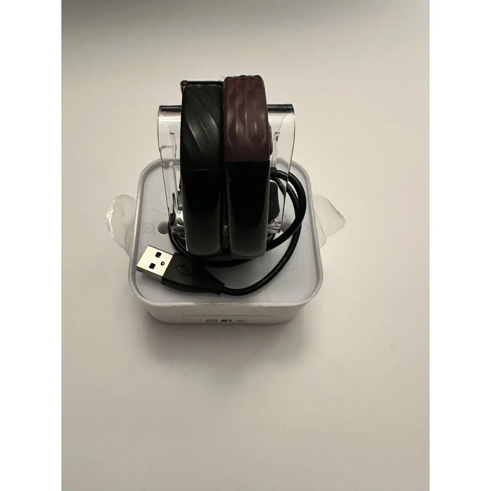 Two itouch slim fitness trackers and 2 chargers (not tested)